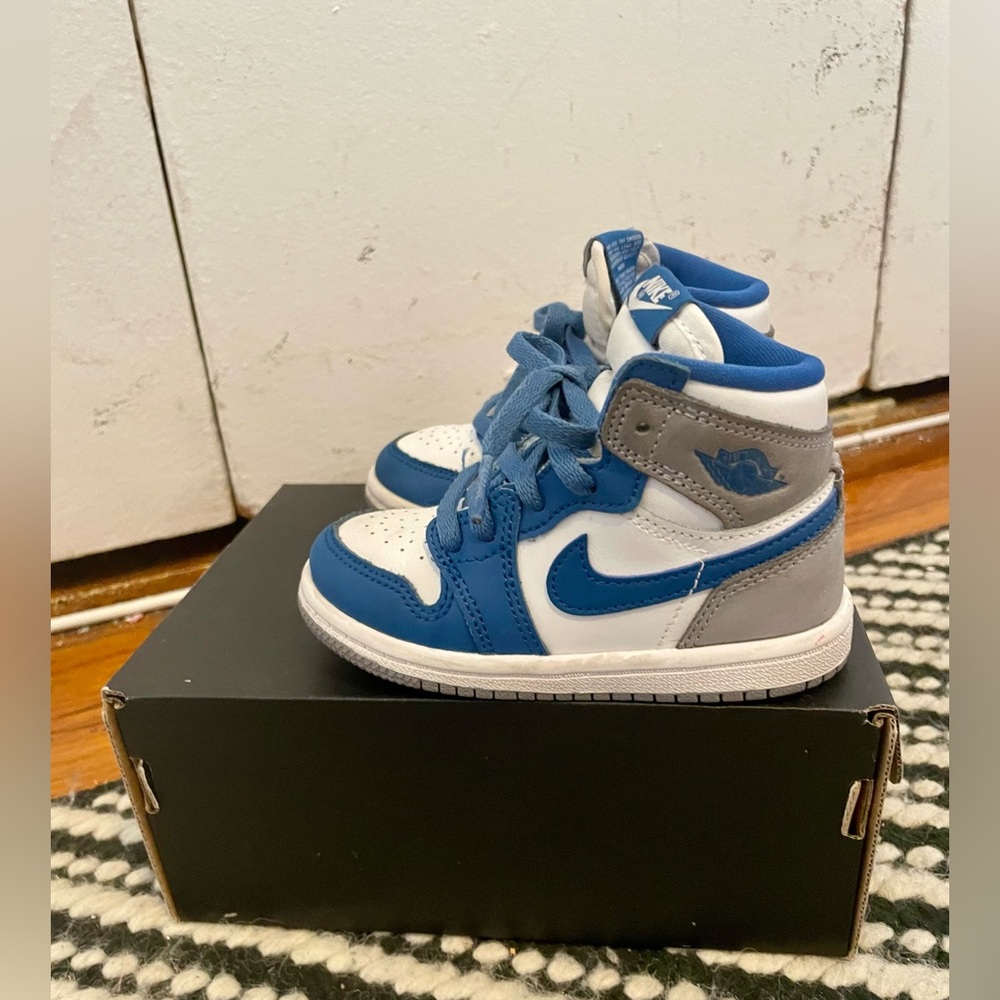 Jordan 1 Retro true blue/white cement grey in a toddler US size 7
